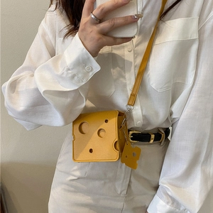 Creative yellow cheese shaped mini crossbody bag with matching shoulder strap and charm