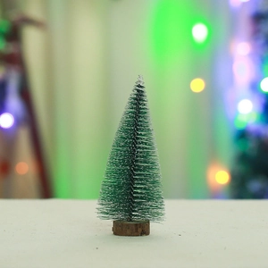 Macro shot of a mini artificial Christmas tree with snow on a rustic wooden base