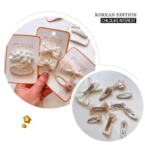 Matcha green and cream bow hair clips set with floral embroidery for kids and girls