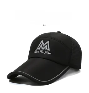 Detail of black mesh baseball cap showing breathable texture and 3D M embroidery