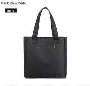 Detail view of the black waterproof nylon tote bag showing the back hidden zipper pocket