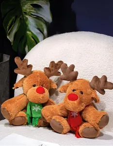 Close-up of reindeer plush dolls with festive red and green snowflake scarves