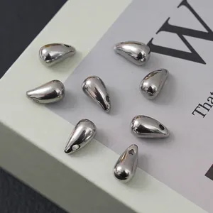 Eight silver teardrop-shaped stainless steel charms with polished mirror finish for DIY jewelry