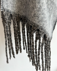Macro shot of gray brushed texture and fringe detail on the star series cashmere scarf