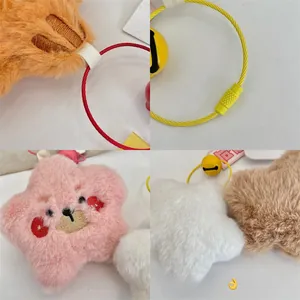 Detail of the rotating steel wire buckle and cute embroidered facial features on plush stars