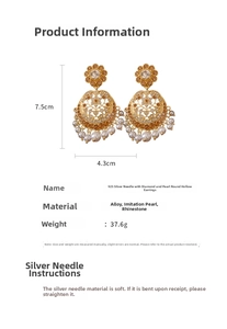 Macro detail of hollow round gold earrings with 925 silver needles and pearls
