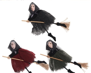 Three Halloween witch figurines in black red and green linen riding wooden straw brooms