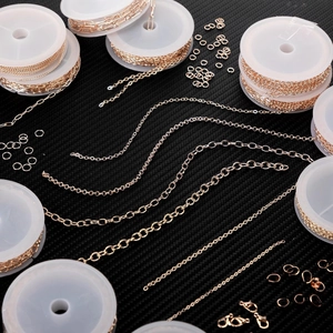 Detail of high-quality gold-plated cross chains with lobster clasps and jump rings set