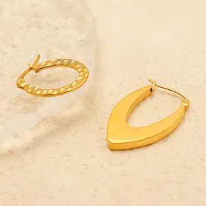Golden stainless steel geometric hoop earrings with polished and hammered texture finishes