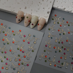 Christmas nail art stickers with gold lines, colorful gems and white snowflakes Co-491