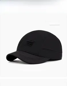 Close-up of black quick-dry baseball cap featuring embroidered Fuzoto logo on white background