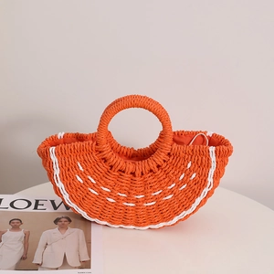 Orange semi-circle straw handbag with woven texture and white drawstring closure