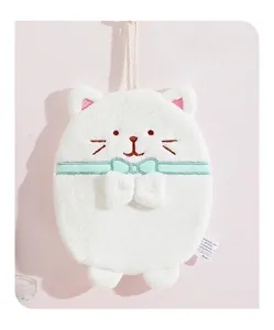 Detail of white cat hanging hand towel with soft plush texture and mint green bow