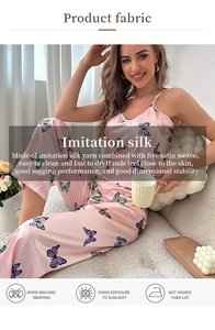 Pink imitation silk pajama set with butterfly print showing fabric drape and features