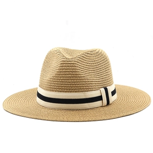 Close-up of Panama straw hat featuring a striped elastic band and fine woven texture