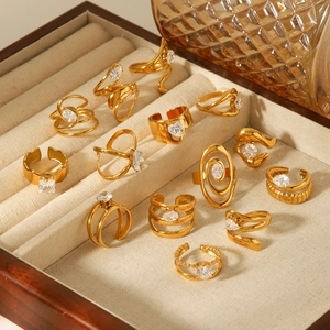 Golden geometric stainless steel rings set with zircon, featuring open adjustable designs