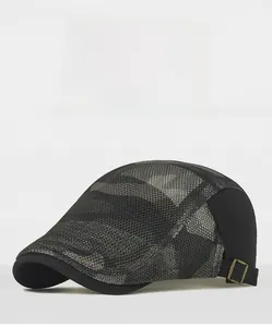 Detail view of breathable black mesh sun hat with camo pattern and bronze metal side buckle