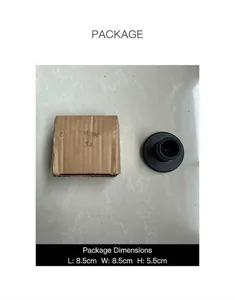 Detail of a matte black T-shaped candle holder with its 8.5x8.5x5.5cm packaging box