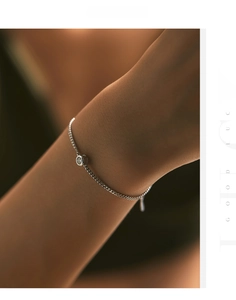 Close-up of minimalist S925 silver bubble chain bracelet with a sparkling moissanite stone
