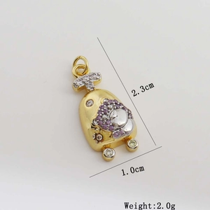 Detail view of purple zircon cartoon pendant measuring 2.3cm by 1.0cm with 2.0g weight