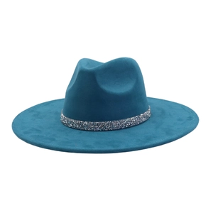 Close-up of peacock blue wide brim fedora hat with sparkly silver sequin trim band