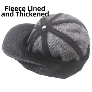 Detail of the thickened fleece lining inside a grey denim newsboy cap for winter warmth
