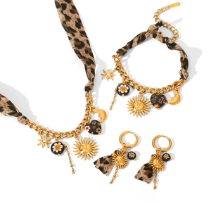 Bohemian gold celestial jewelry set with leopard print fabric, sun and moon charms