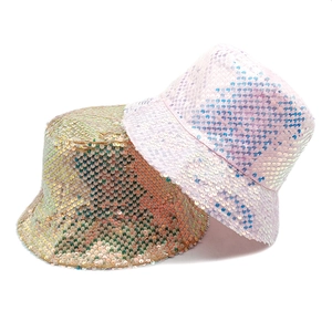 Fashionable sequin bucket hats in pink and gold featuring a reversible sun protection design