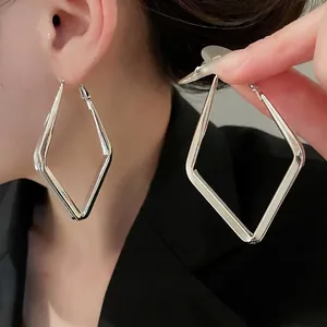 Minimalist silver geometric rhombus earrings with polished metallic finish for women
