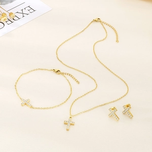 Elegant gold stainless steel jewelry set with sparkling crystal cross necklace and bracelet