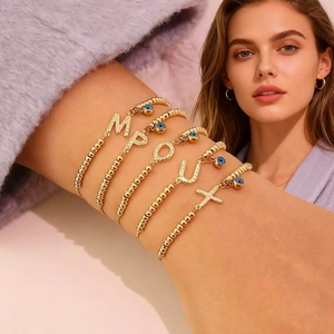 Bracciali a sfere dorati regolabili con malocchio e ciondoli a lettera per donna