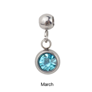 Macro view of stainless steel March birthstone pendant with light blue gem and engraving