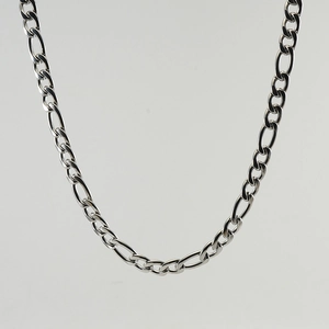 Macro detail of silver stainless steel curb chain with polished metal link texture
