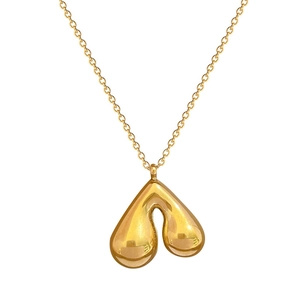 Minimalist gold titanium steel necklace featuring a molten heart pendant on a thin chain