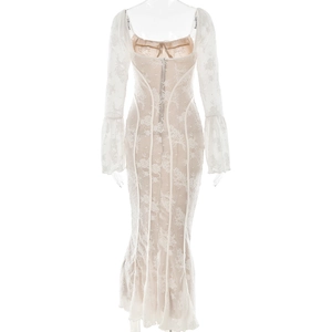 Back view of white lace maxi dress featuring trumpet sleeves and mermaid hem silhouette