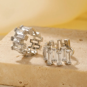 Elegant silver circle earrings with rectangular zircon stones on stone base pedestal