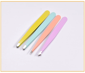 Close-up of four colorful stainless steel tweezers in pastel yellow, blue, and pink