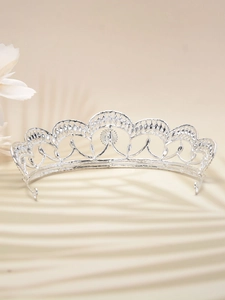 Detailed view of silver bridal crown with intricate wave design and clear crystals