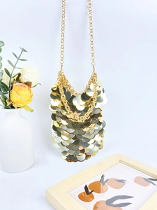 Sparkly gold sequin chain body jewelry for women presented with floral decor