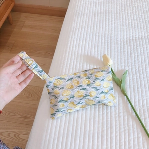 Floral cotton mini tote bag for cosmetics with yellow-green floral patterns and wristlet