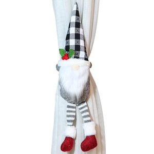 Gnome Christmas curtain tieback with black and white plaid hat on white curtains