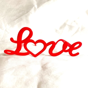 Funny red Love letter shaped sunglasses for Valentine's Day photo props on white background