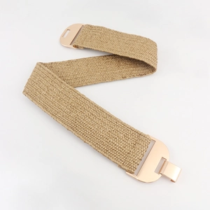 Close-up of elastic woven khaki straw belt with geometric gold metal buckle in Z-fold