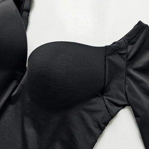 Sleek black seamless push-up bra with shaping cups and minimalist design detail