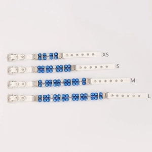 Detailed comparison of four sizes of white pearl pet collars with blue beads and silver buckles