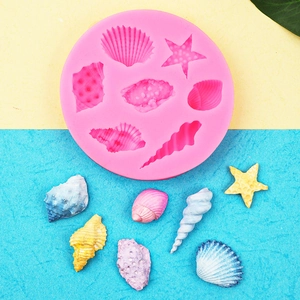 Pink starfish and seashell silicone mold for DIY ocean themed cake decorations