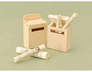 Close-up of miniature wooden dollhouse mailboxes with tiny rolled newspaper accessories