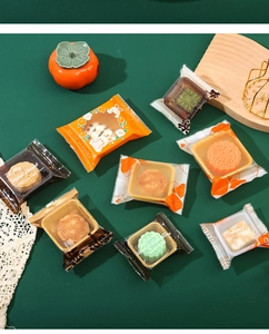 Detail of assorted mooncake packaging with rabbit patterns and floral gift bags