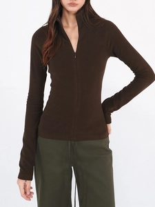 Detailed view of women slim-fit mock neck sweatshirt with zipper in dark brown color