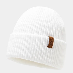 Minimalist white knit beanie with brown leather IACUGGL patch for winter warmth